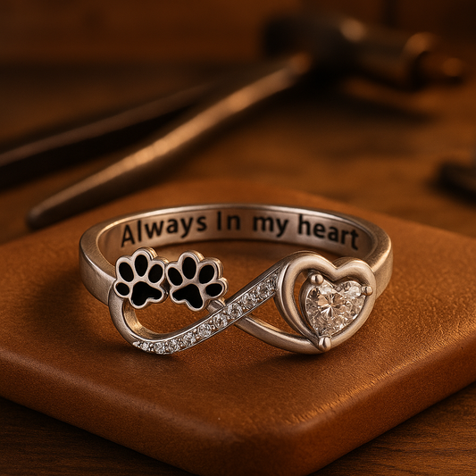 Ring with paw-shaped zircons featuring a heart and infinity design