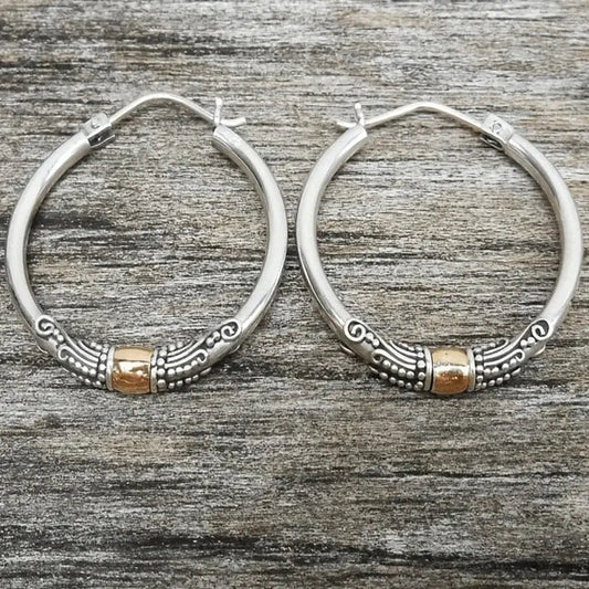 Vintage silver hoop earrings with sculpted pattern